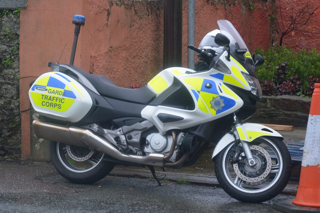 Careless driver knocked traffic garda off his motorbike Careless driver knocked traffic garda off his motorbike